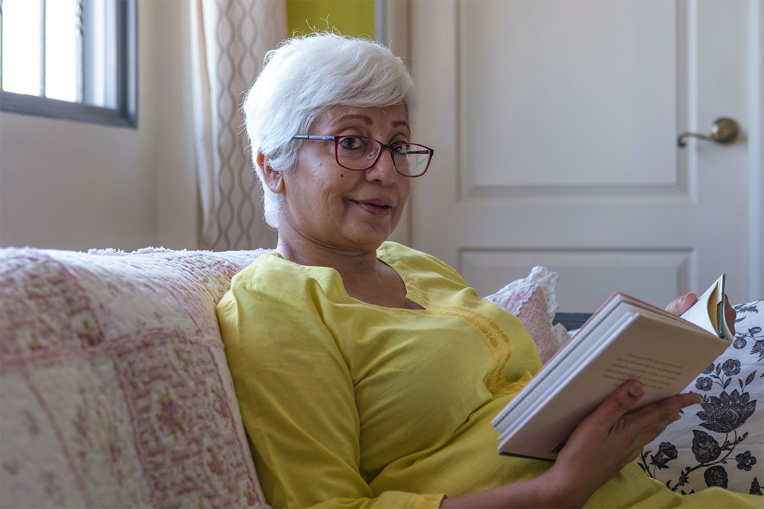 Resident reading a book, relaxing 