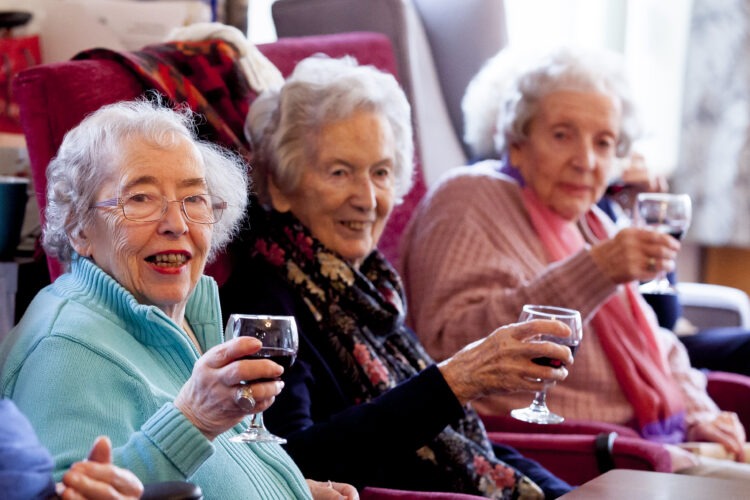 residents enjoying a glass of win