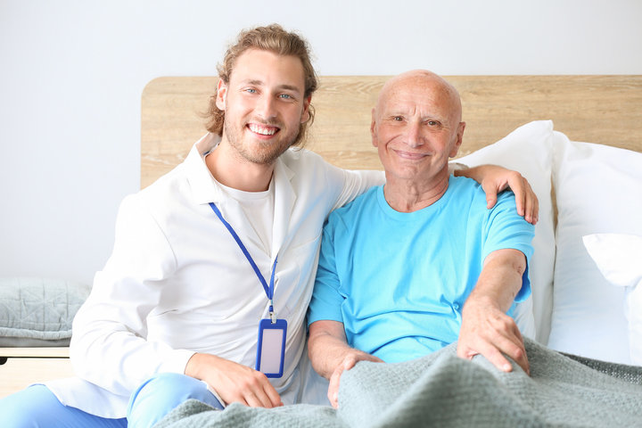 son and father on a nursing bed